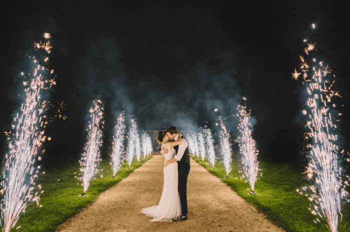 Firework fountains frame the happy couple